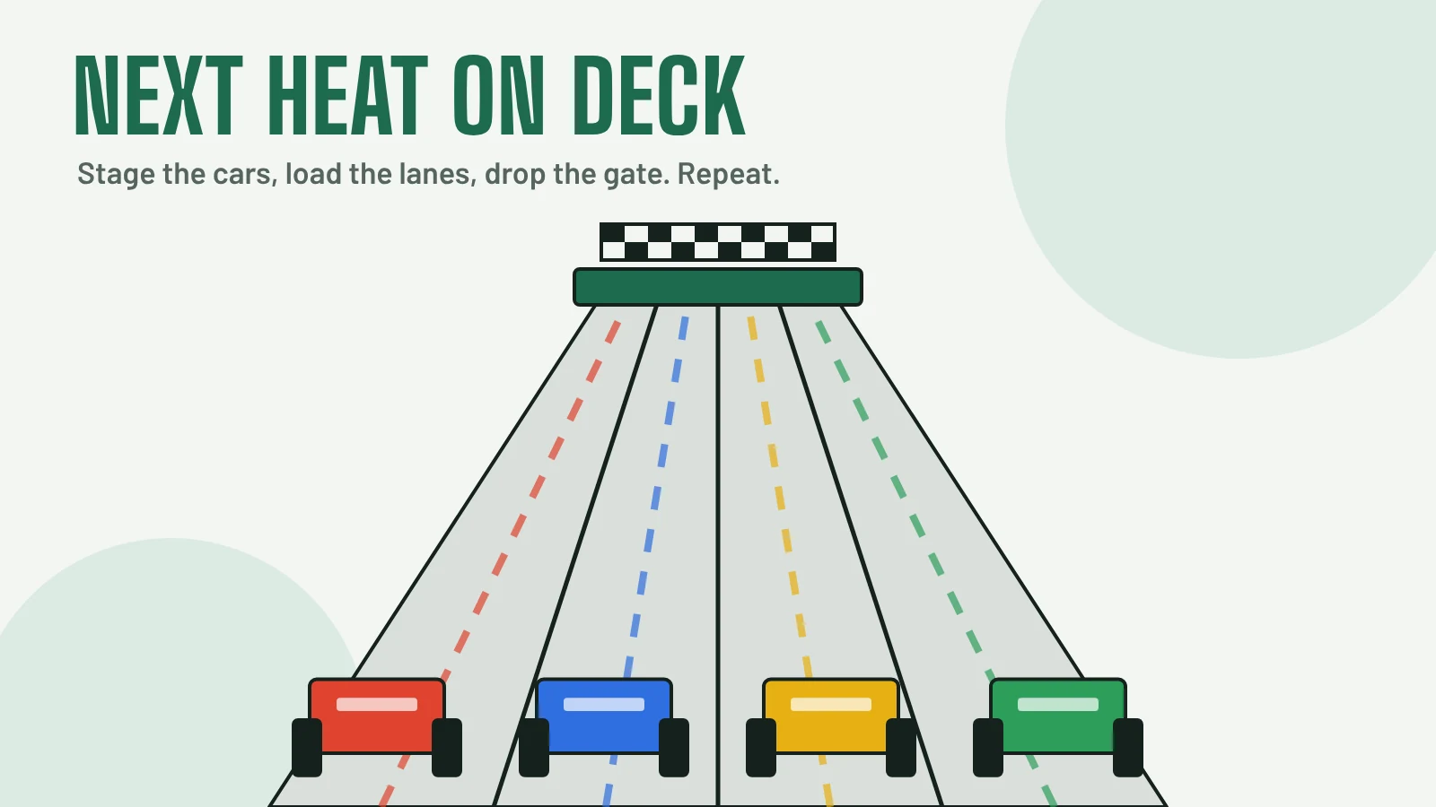 Adult volunteers lining up wooden pinewood derby cars at the starting gate of a four-lane track
