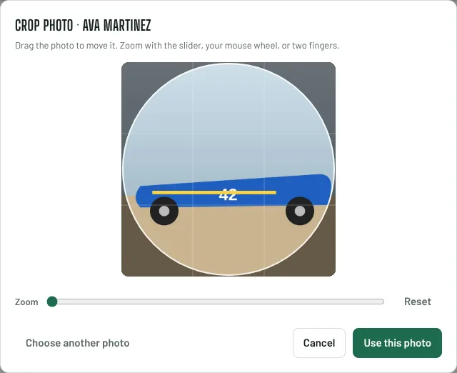 The crop photo window showing a blue pinewood car inside a circle, with a zoom slider and a Use this photo button.